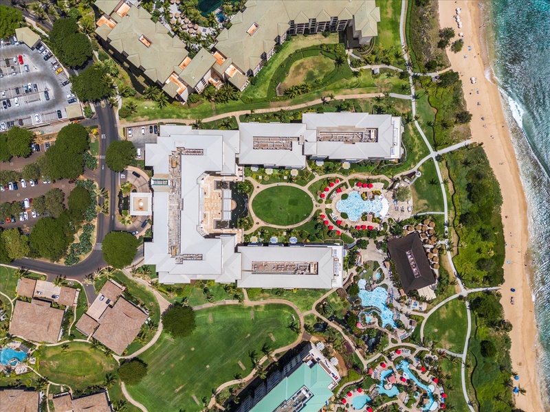 An aerial view showcasing the expansive layout and lush surroundings of the resort, complete with beautifully landscaped gardens and luxurious amenities.