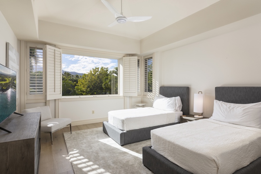 Third bedroom (upper level) with two twin-size beds (king conversion upon request) and smart TV with an adjacent full bath