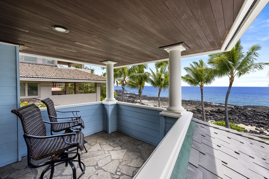 Intimate lanai nook provides a cozy spot to relax and take in the ocean breeze.