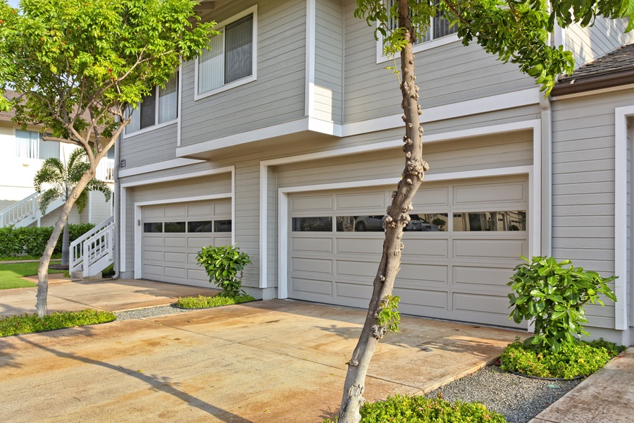 The large garage and smooth driveway parking.