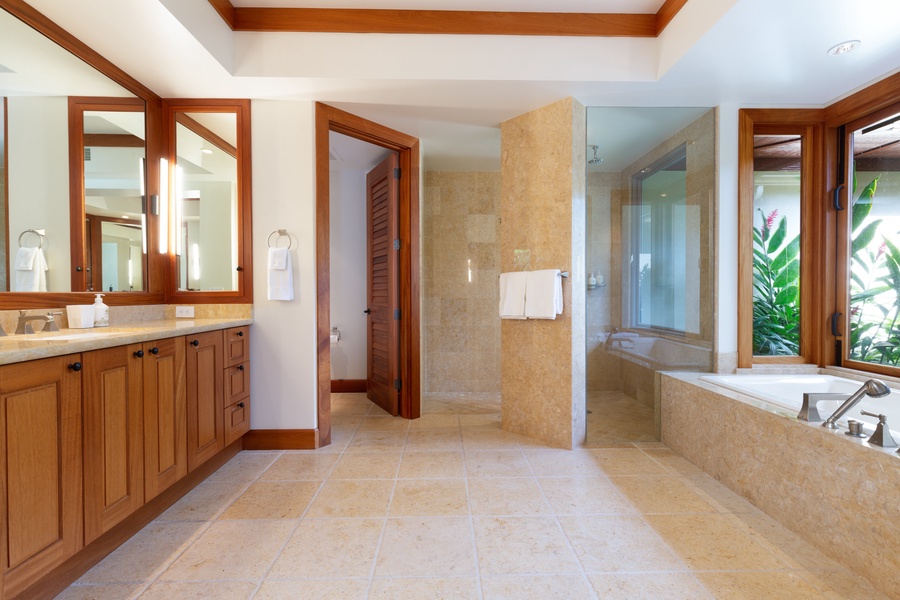 Reverse view of the primary bathroom showcasing the walk-in shower & private w/c