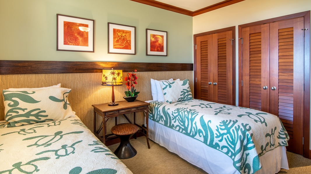 The third guest bedroom features brightly patterned twin beds.