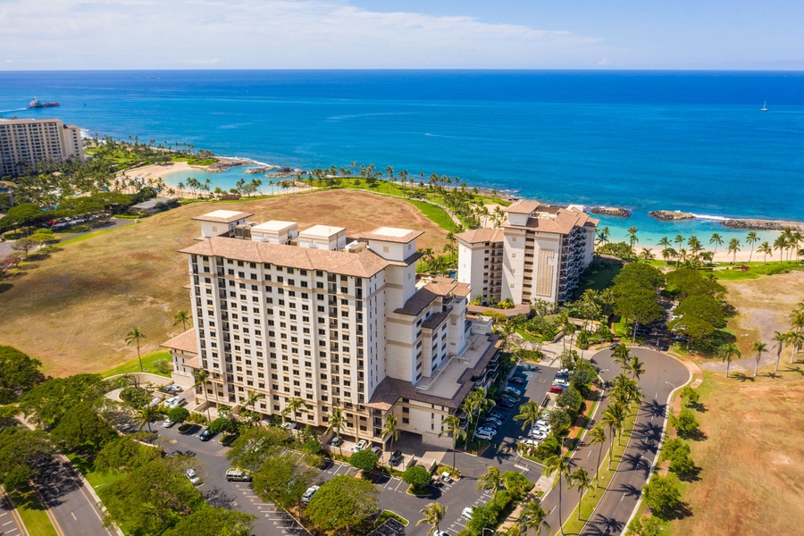 Spectacular aerial view showcasing the resort's prime beachfront location with crystal-clear waters and pristine sandy shores nearby.
