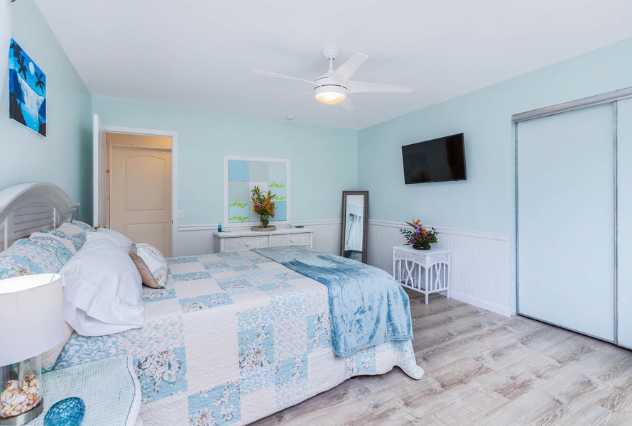 A tranquil guest bedroom offering a queen-sized bed and thoughtful touches.