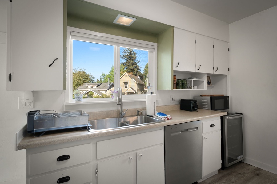 Start your mornings with coffee and neighborhood views from the kitchen window.