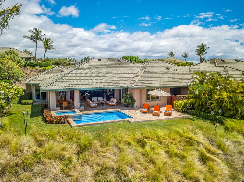 A stunning bird’s-eye perspective of your private villa, complete with pool, spa, and outdoor living spaces surrounded by lush tropical landscaping.