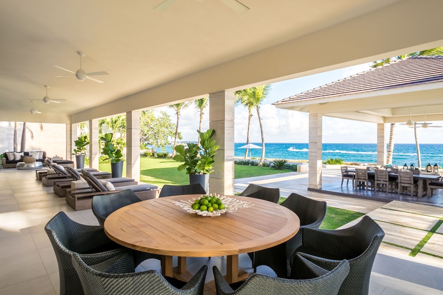 Spacious outdoor table, perfect for meals with a view of the serene blue waters.