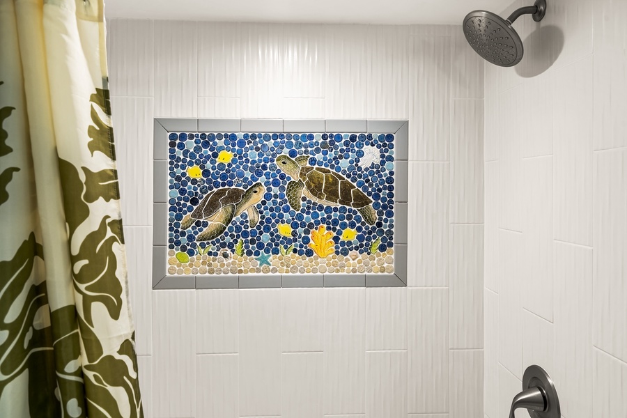 Guest bathroom shower with mosaic tile design