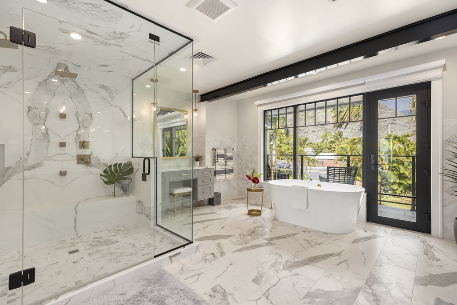 Private ensuite with a double vanity, walk-in shower, and relaxing soaking tub