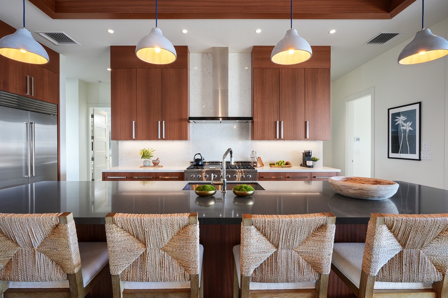 A stylish kitchen with bar seating, high-end finishes, and everything you need to cook with ease.