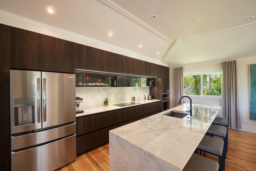 Modern kitchen with stainless steel appliances and a sleek design.