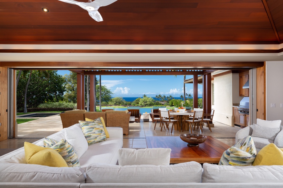 The great room opens to the lanai, granting expansive views