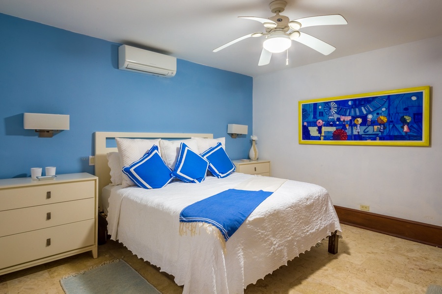 The guest suite has a king-sized bed.