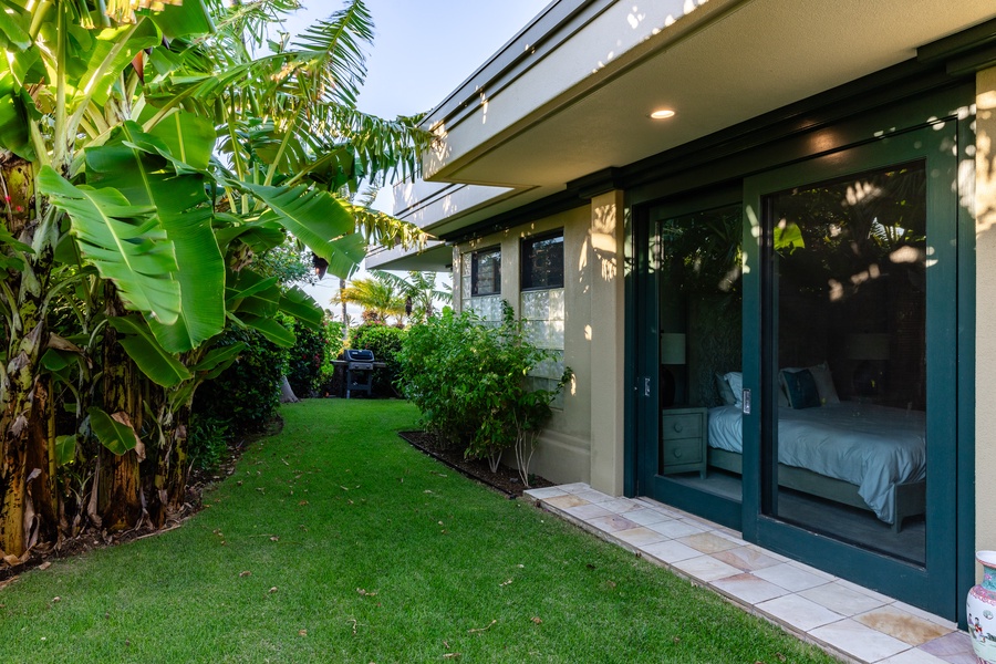 Lush garden area with tropical plants and easy access to the home