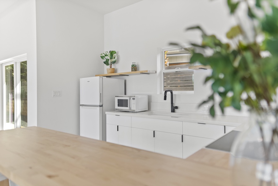 The prep kitchen offers wide counters and plenty of cabinetry for stress-free cooking.