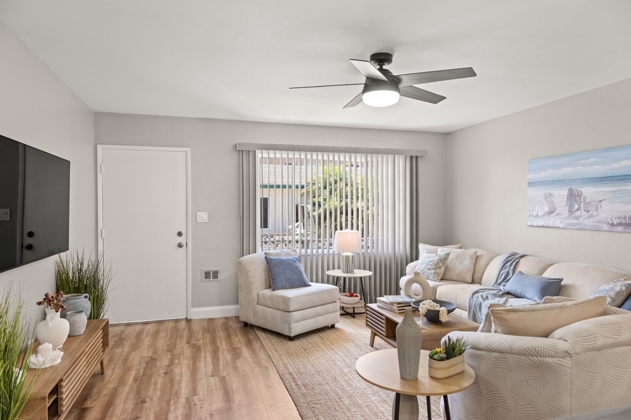 The living area features an airy and modern design style.