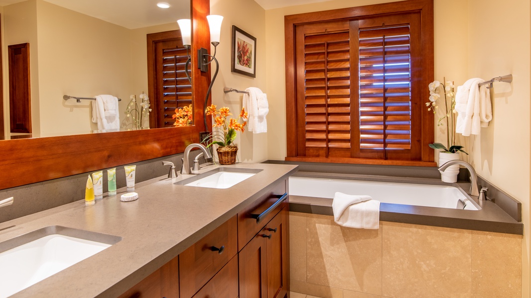 The primary guest bathroom features a luxurious soaking tub.