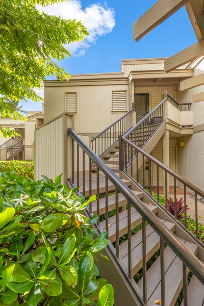 Lush greenery and private stairway entrance enhance your secluded getaway.