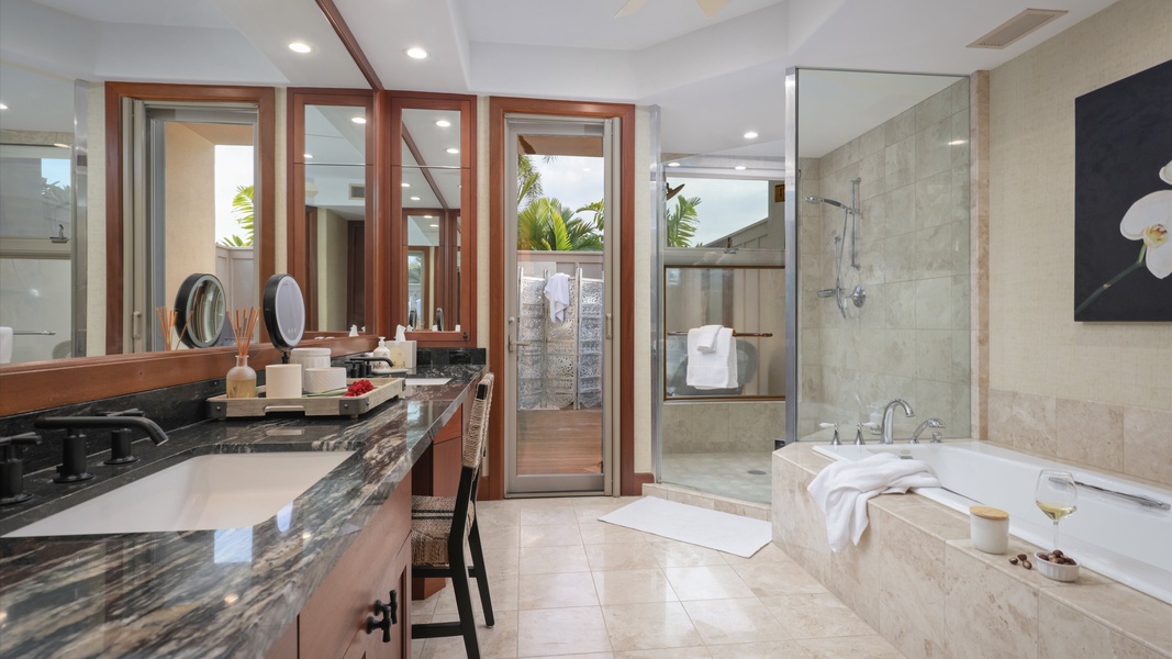 The bathroom offers a luxurious space with a soaking tub and a spacious double vanity.
