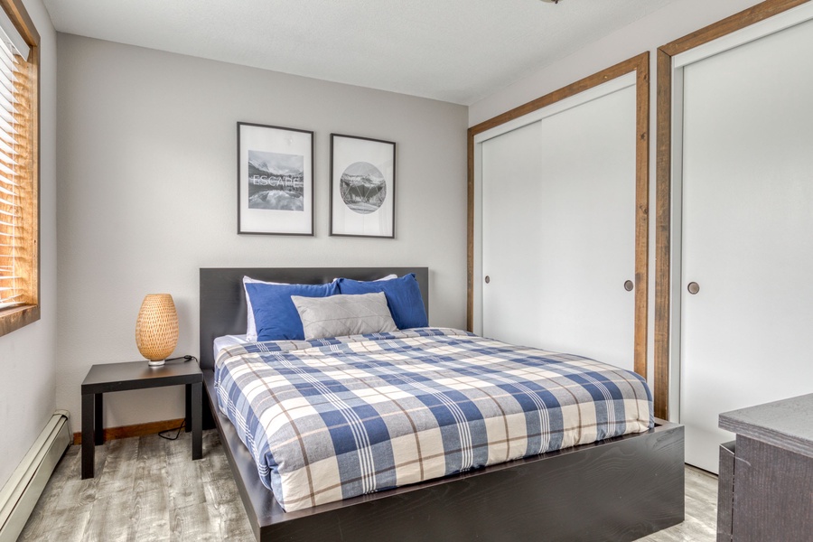 The Primary bedroom comes with a comfortable queen-sized bed with a dresser and a large closet