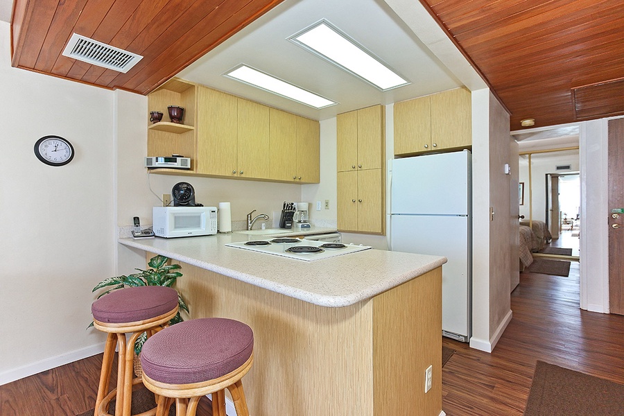 Enjoy a fully equipped kitchen with breakfast bar seating.