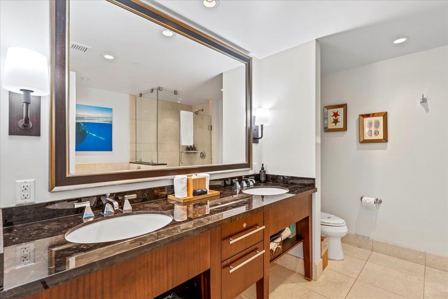 Start your day fresh with double sinks in the spacious bathroom at Honua Kai Hokulani 825.