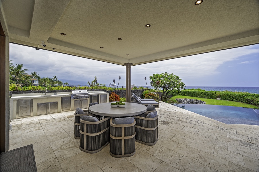 Outdoor area seamlessly connects to built in BBQ area with ice maker and new concrete BBQ top