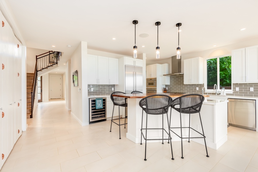 Central kitchen and dining area with clean lines and bright lighting for a welcoming feel.