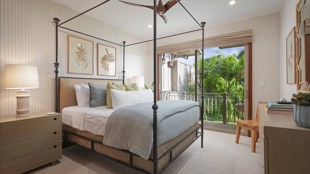 The secondary suite on the upper level boasts a Cal King bed, bathroom, and a private lanai.
