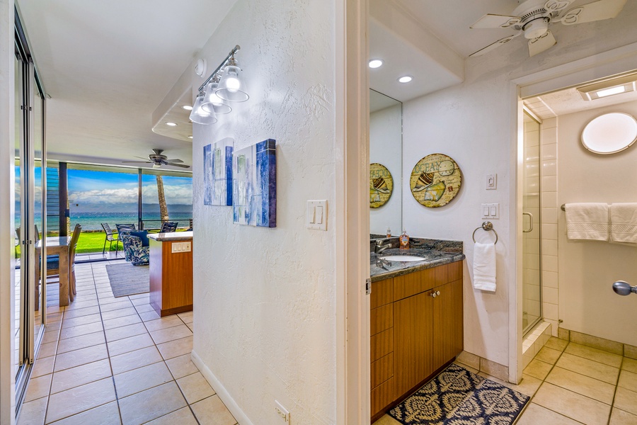 Conveniently located near the living space, Papakea L-106’s hallway bathroom features a contemporary vanity and stylish decor