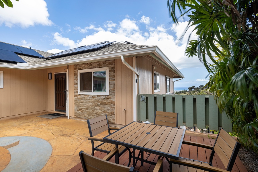 A detached guest house-style entrance leads to flexible quarters with a private sitting area and small dining nook for added privacy.