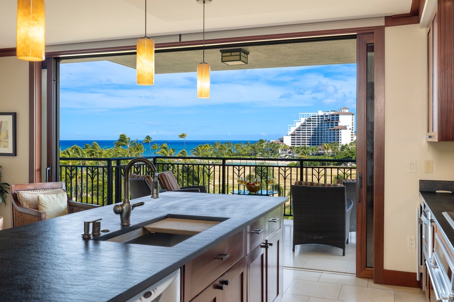 A spacious kitchen island and living area invite you to cook, dine, and relax in comfort while soaking up the island ambiance.