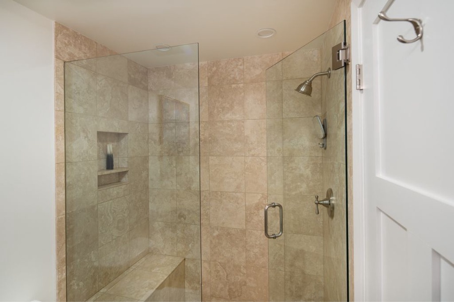 Shared guest bathroom with a walk-in shower.
