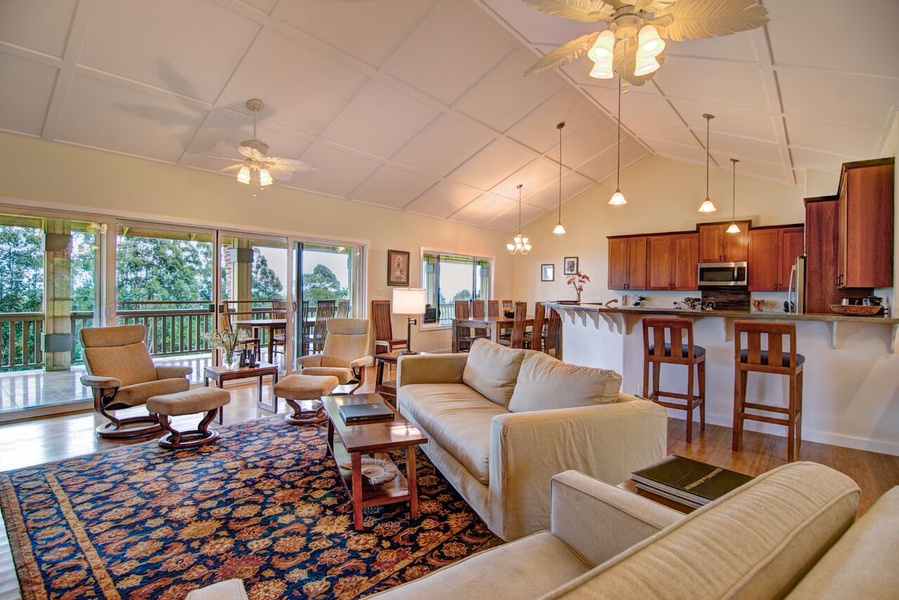 The entire living area opens to the 60 foot long back lanai with ocean and garden views
