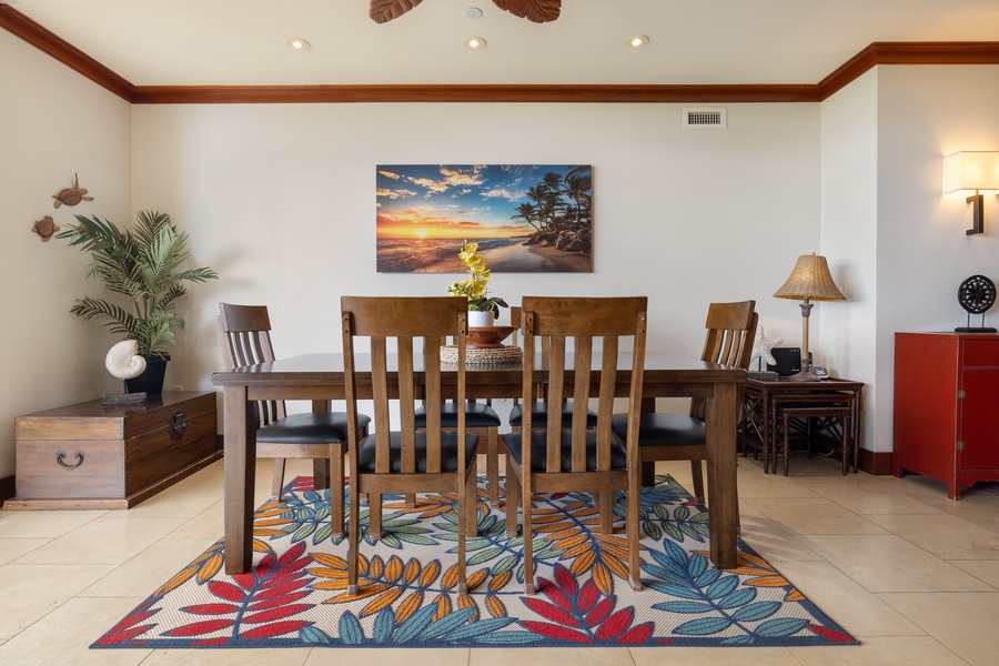 Gather around your elegant dining table with sunset views to inspire memorable meals together in this tastefully decorated space.