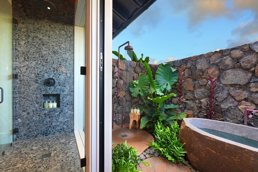 Experience spa-like luxury with the outdoor soaking tub and shower for a tranquil and relaxing afternoon..