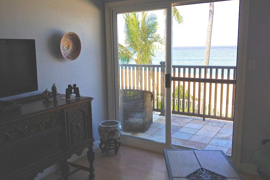 Living area with direct access to lanai with ocean views.