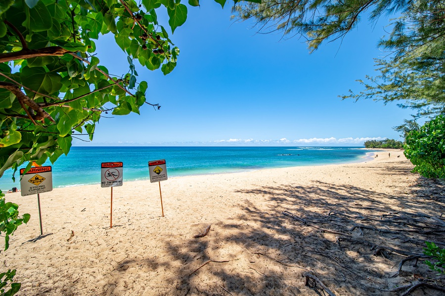 Nearby Velzyland Beach—golden sand and calm waters await a short stroll from the retreat.