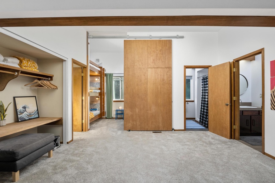 A sliding barn door closes off the space for the bunk beds in the common area