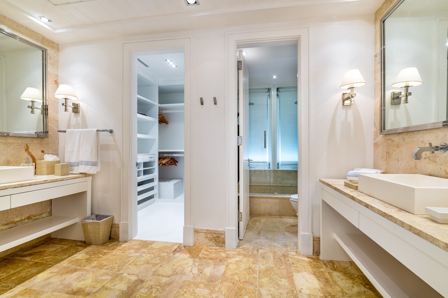 Freshen up in the elegant ensuite bathroom, boasting modern amenities, a spacious vanity, and a walk-in shower.