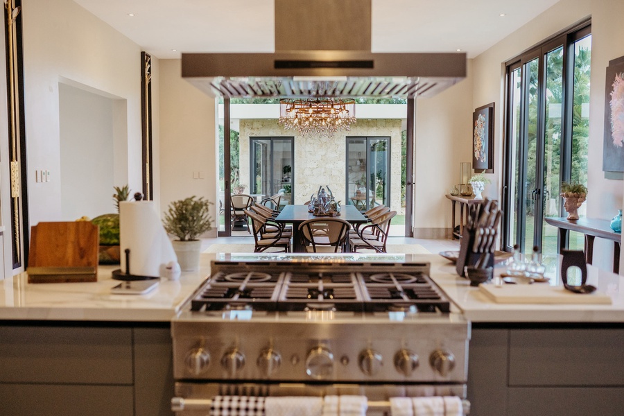 A view from the modern kitchen through to the stylish dining room.