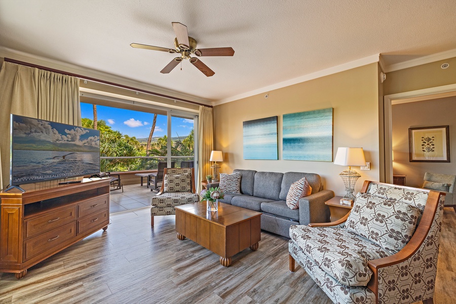 Step inside the living area featuring a cozy pull-out sleeper sofa for extra sleeping and stunning views from the large windows.