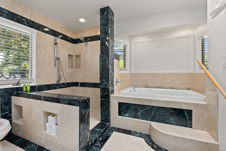 Ensuite bathroom with a large soaking tub and a separate shower.