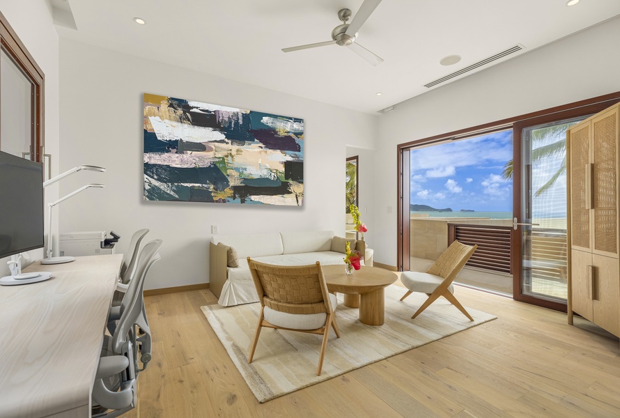 Relaxing seating area with artful decor and expansive views, a cozy spot to unwind.