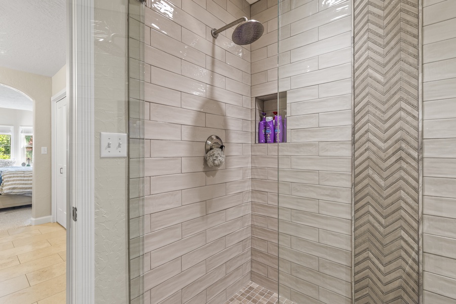 Walk in shower with glass enclosure