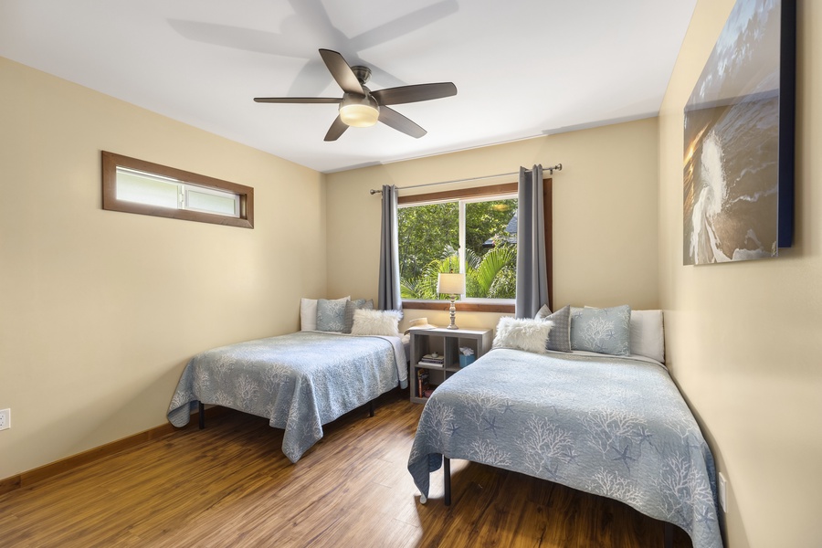A second bedroom upstairs has two full-size beds for flexible sleeping arrangements.