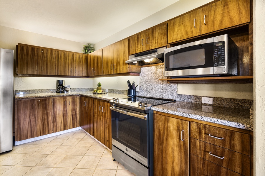 Upgraded kitchen with stainless appliances and Koa cabinets!