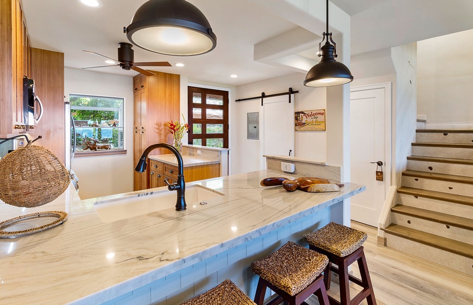 Elegant breakfast bar with seating, inviting you to savor casual meals or morning coffee.