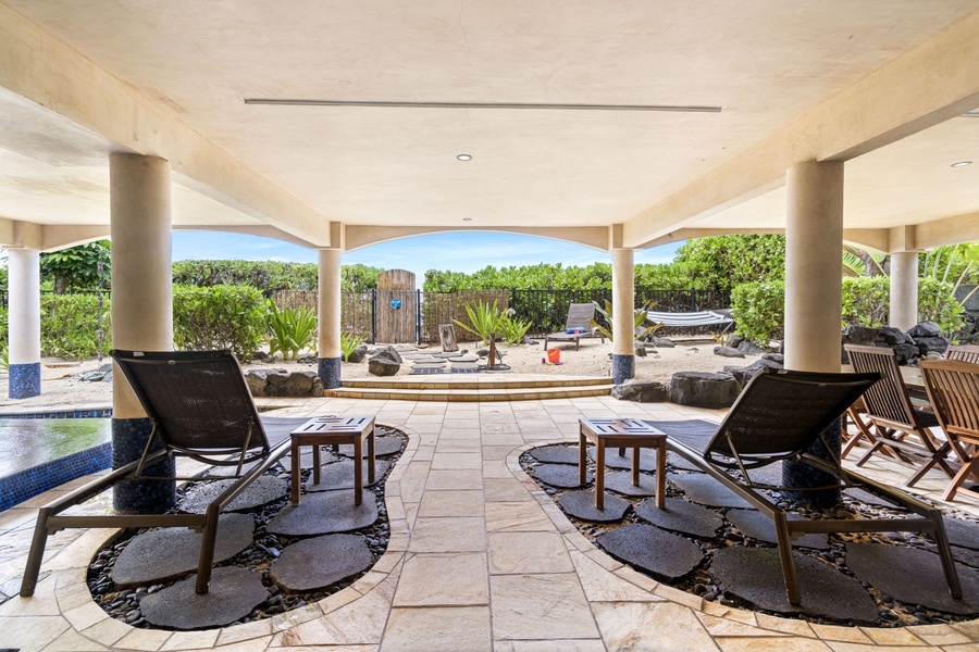 Poolside lounge area shaded for comfort—perfect for afternoon drinks or watching the kids play.