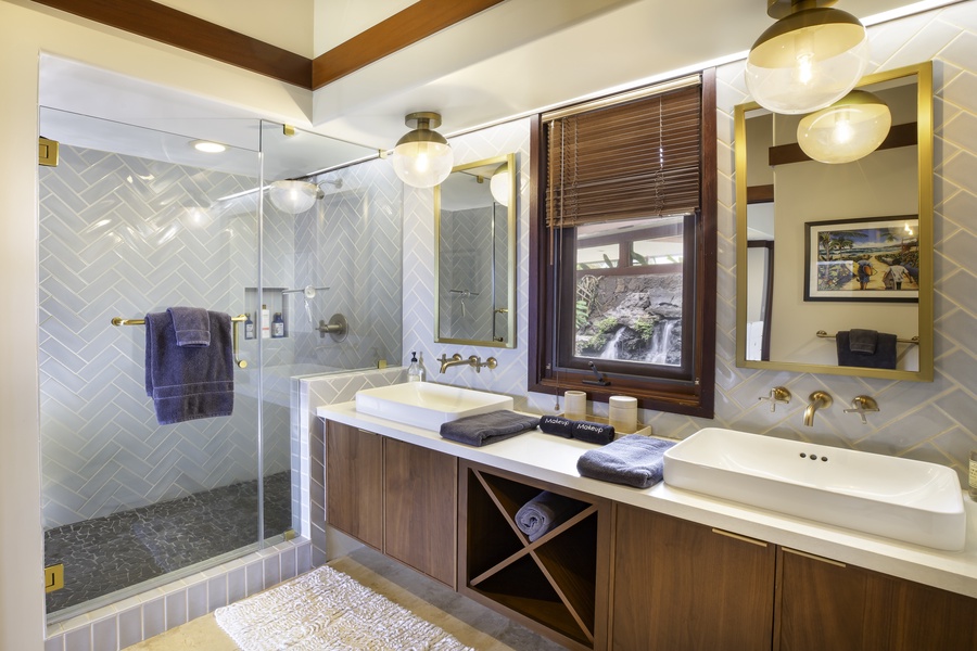 Unwind in your spa-like bathroom with herringbone tile, double vanities, and a waterfall view from your shower.